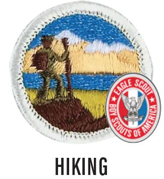 Image of a Hiking merit badge. The badge is blue with a white border and a person standing on a cliffside, looking over a bluff.